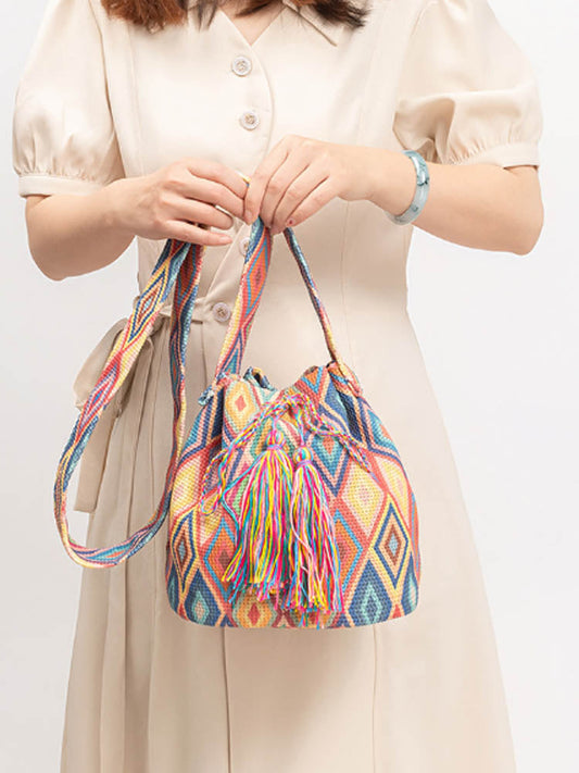 Trykt lerrets crossbody-veske